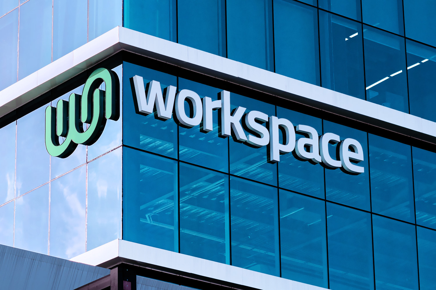 Close up of building with extruded logo signage of Worskspace horizontal logo